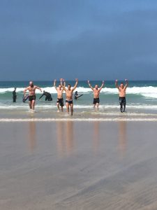 cool-down swim post-training at the beach right outside the gym